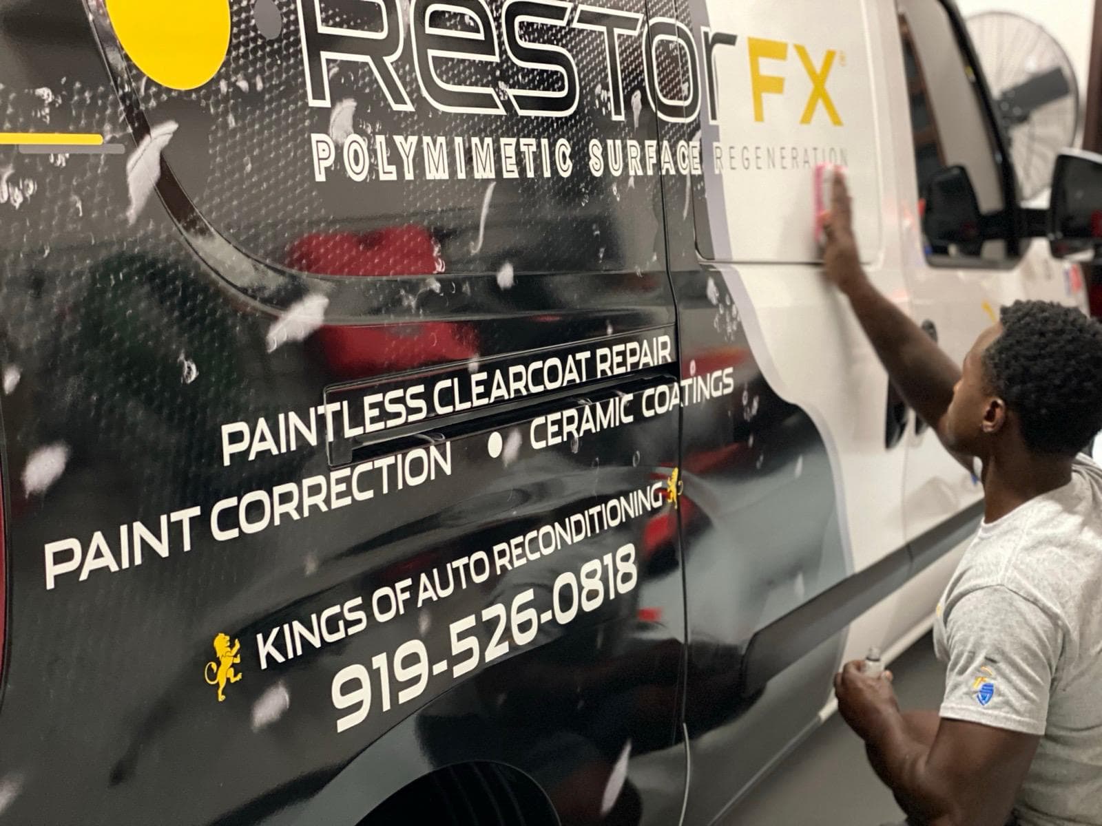 Commercial vehicle wrap with business branding — full vehicle