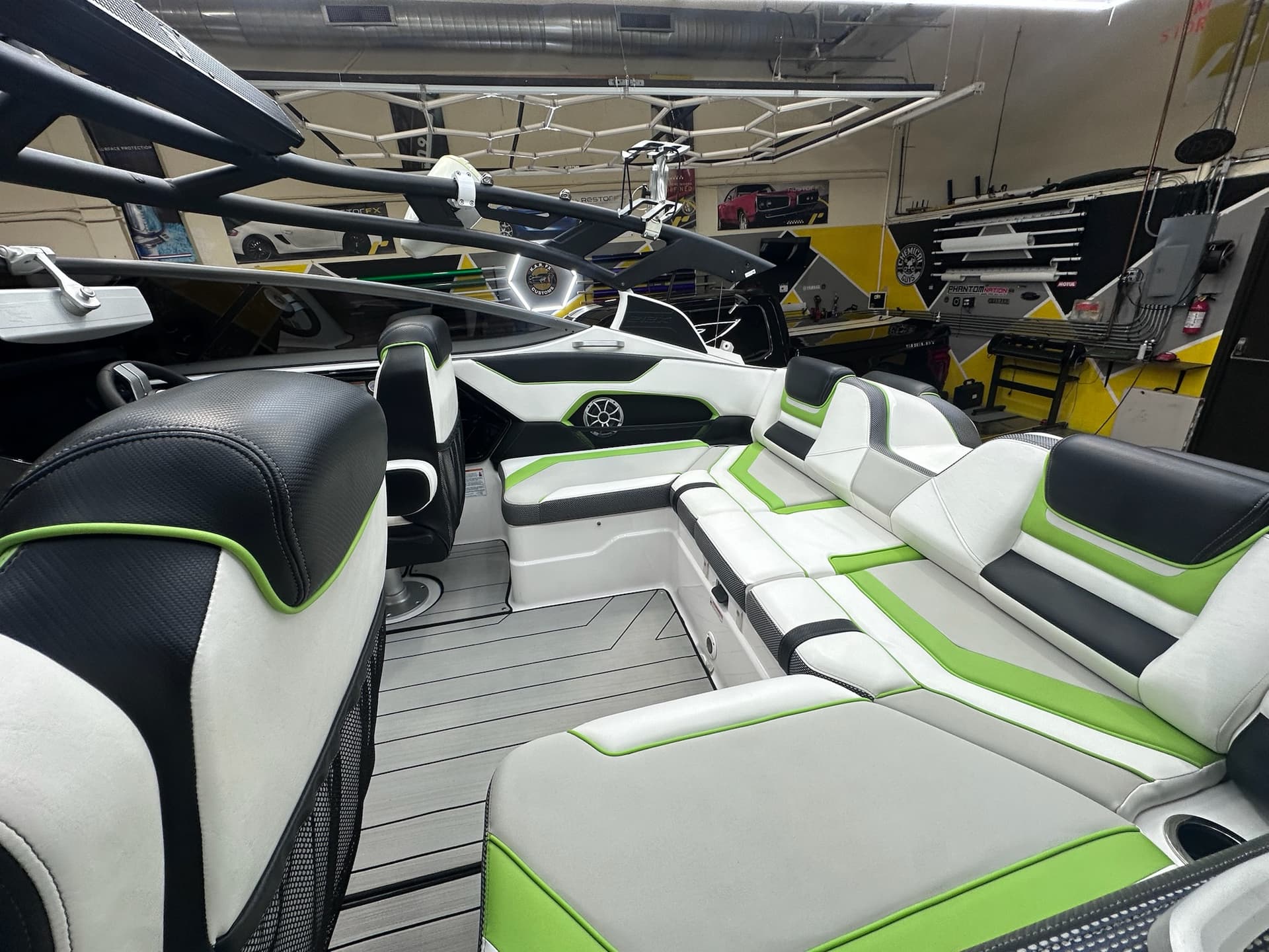 Green and white boat seating and trim inside the workshop