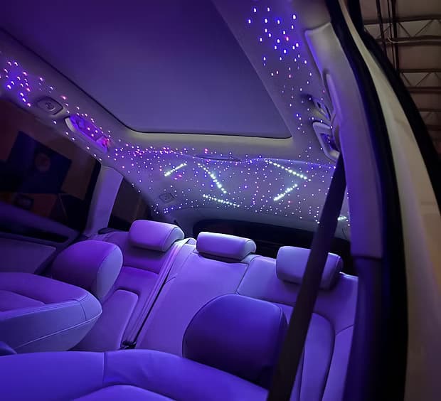 Illuminated starlight ceiling inside a vehicle cabin